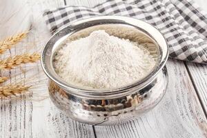 Wheat flour heap for bake photo