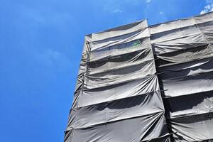 Dust Cover Net of Under Construction Building. photo