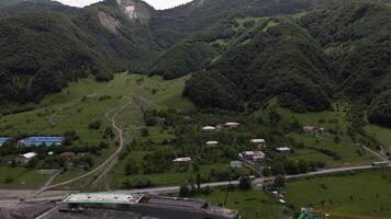 Kazbegi, Georgia - 7th july, 2024 - aerial view cranes and bridge foundation pillars on construction site of new highway road project built by chinese builders.Avalanche bypass tunnel.Tbillisi - Lars video