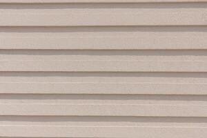 Beige Textured Wall with Horizontal Lines for Background or Architectural Design. photo