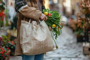 woman carrying reusable bag in hand. photo