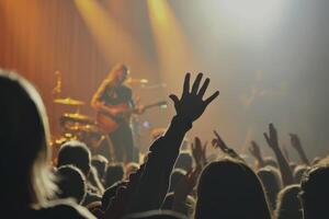 Caught up in the vibe. A huge group of fans screaming at a rock concert. photo