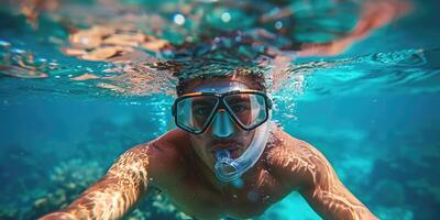 handsome man snorkeling underwater. photo