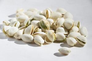 close up Seeds of pistachio nuts, chickpeas, peanuts isolated, white background photo