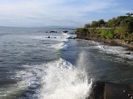 The beauty of Tanah Lot Beach, Bali, Indonesia photo