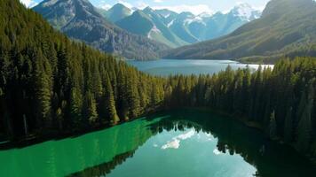 A tranquil lake surrounded by dense forests and mountains. Bright, natural lighting to capture the serene setting. video