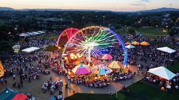 A large amusement park with rides and attractions. Bright, even lighting to capture the excitement. video