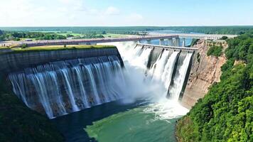 A large dam with water flowing over it. Bright, even lighting to capture the engineering marvel. video