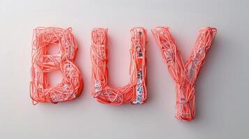 The word Buy created in Coral Letters. photo