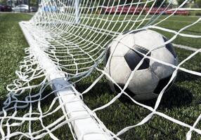 Goal in the back of net in soccer game photo