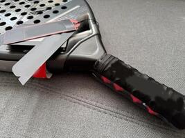 Detail of padel racket handle photo