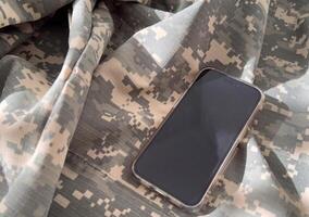 Mockup of a smartphone with a white screen on a dark concrete background. 3D rendering. photo