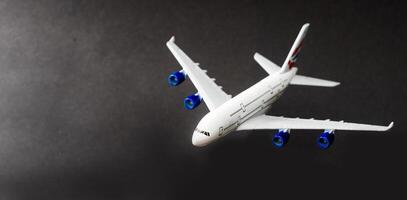 Model plane, airplane on dark background. photo