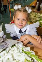Portrait of young first grader, day of knowledge, beginning of the school year photo