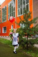 Portrait of young first grader, day of knowledge, beginning of the school year photo