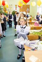 Portrait of young first grader, day of knowledge, beginning of the school year photo