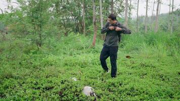 Hikers with backpacks bring garbage bags to collect trash in the forest for a clean world. Protect the environment and the ecosystem while walking among nature Volunteers collect trash, safe world video