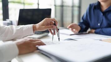 Architecture drawing on architectural project business architecture building construction Colleagues designer Planning Design on blueprint and compasses photo