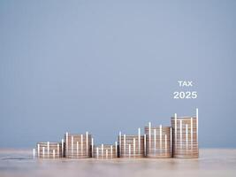 Stack of coins with virtual increasing graph. The concept of saving money for payment tax, business growth, Financial investment, Market stock, Profit return, Dividend and Business fund in year 2025. photo