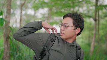 Man hiking in the tropics There was an obstacle a branch stuck to the jacket video
