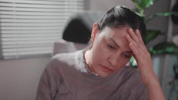 Close-up of a woman working in front of a computer in the morning and feeling tired from working for a long time. video