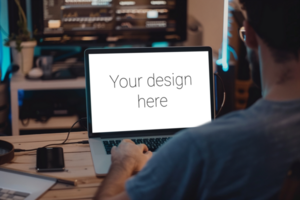Mockup of gray laptop on table. Man working with laptop. Back view psd
