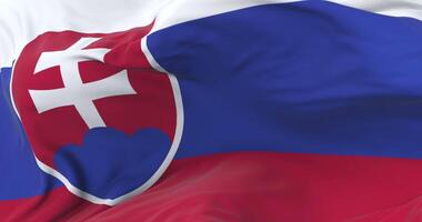Slovakia flag waving at wind in slow in blue sky, loop video