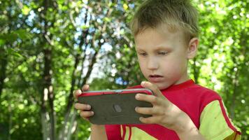 child isolated from nature due to excessive fascination with a mobile device raises concerns about the impact of technology addiction on child development video
