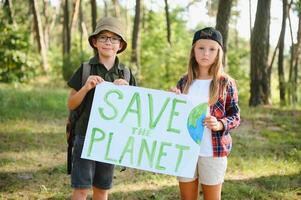 Children are holding a poster Save the planet. Earth Day. Let's save the planet from pollution. photo