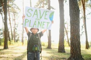 demonstration against global warming and pollution. Child boy making protest about climate change, plastic problems, global warming, pollution. Save the planet poster. Climate Strike. Eco Activism. photo