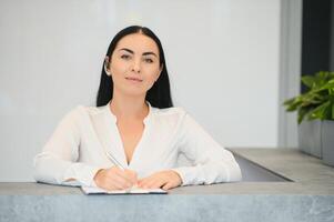 Picture of pretty receptionist at work. photo