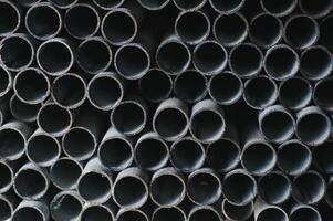 Stack of rolled metal products, perspective view of steel pipes of rectangular cross-section photo