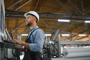Smart factory worker or engineer do machine job in manufacturing workshop . Industry and engineering concept . photo