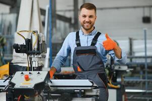 Factory worker. Man working on the production line. photo