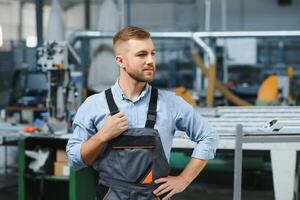 Factory worker. Man working on the production line. photo