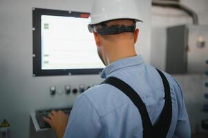 Factory worker. Man working on the production line. photo