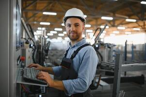 Factory worker. Man working on the production line. photo