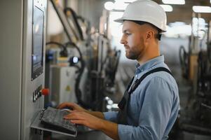 Smart factory worker or engineer do machine job in manufacturing workshop . Industry and engineering concept . photo