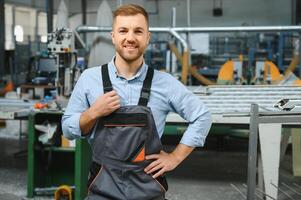 Factory worker. Man working on the production line. photo