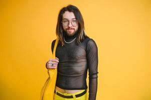 Gay man on a colored background in the studio. The concept of the LGBTQ community. Equality. photo