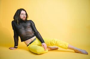 Portrait of a gay man on a colored background. Gender equality. The concept of the LGBT community. Equality. photo