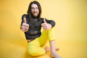 Portrait of a gay man on a colored background. Gender equality. The concept of the LGBT community. Equality. photo