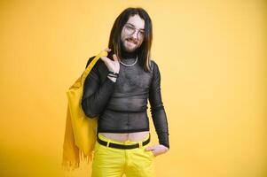 Gay man on a colored background in the studio. The concept of the LGBTQ community. Equality. photo