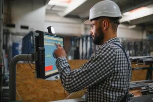 Factory worker. Man working on the production line. photo