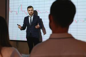 Analyzing data, graphs and reports for investment purposes. Creative teamwork traders. photo