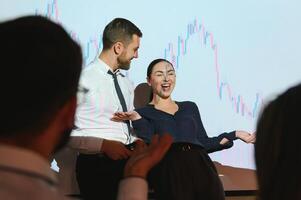 Group of business people working at modern office.Technical price graph, red and blue candlestick chart and stock trading computer screen background. Double exposure. Traders analyzing data photo