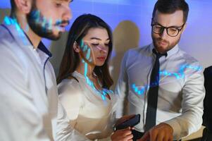 Group of business people working. Technical price graph and indicator, red and blue candlestick chart and stock trading computer screen background. Traders analyzing data photo