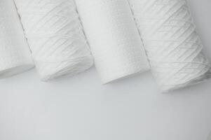 filter cartridges for water on a white background. Installation of reverse osmosis water purification system. photo