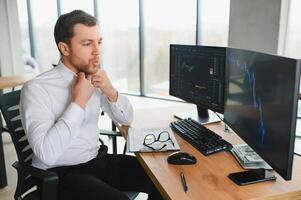 Stressed business man crypto trader broker investor analyzing stock exchange market crypto trading decreasing chart data fall down loss, desperate about losing money of crisis, recession, inflation. photo