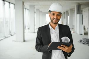 Asian Engineer standing on site construction posting confident , Engineer construction happy job success with in target planning photo